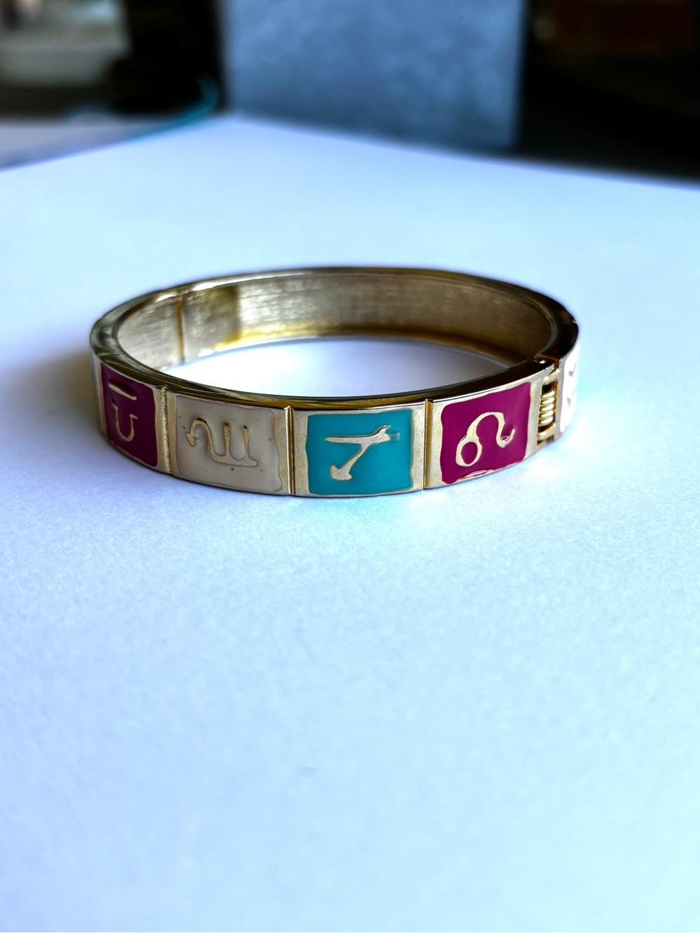 Gold-Tone Enamel Zodiac Panel Bangle Bracelet in Pink, Teal, and Cream